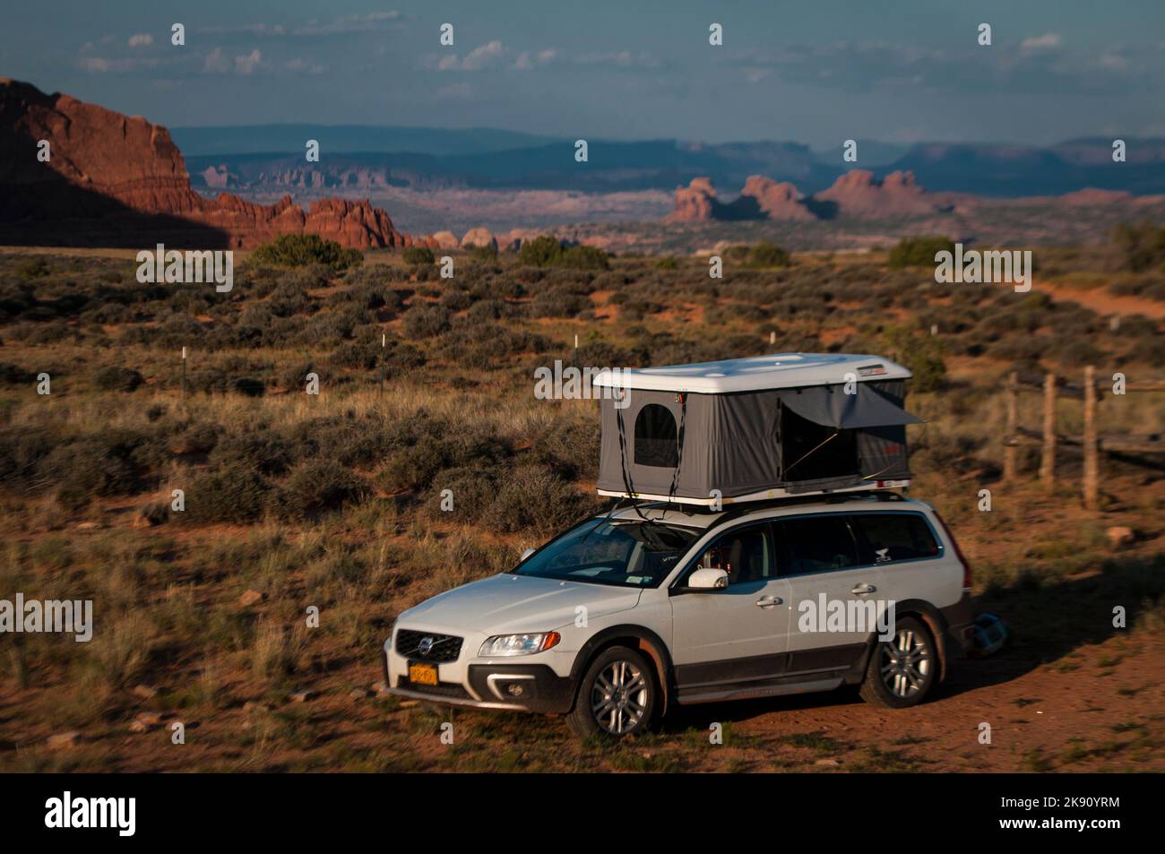 A white car camping in Utah with a roof top tent Stock Photo - Alamy