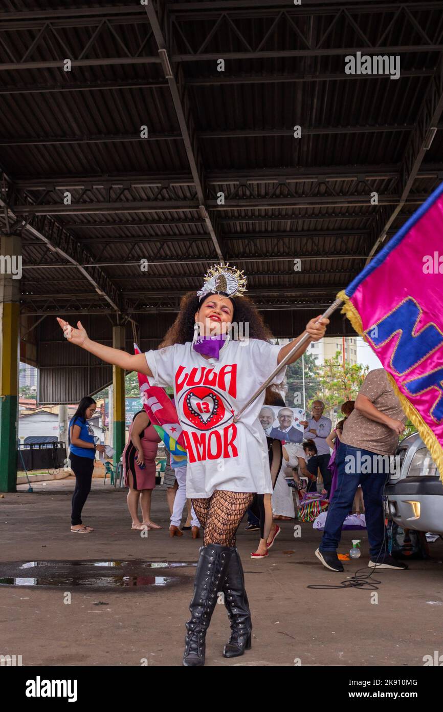 Goiânia, Goias, Brazil – October 21, 2022:  A woman holding a flag and wearing a T-shirt with the text: Lula - 13 - love. Stock Photo