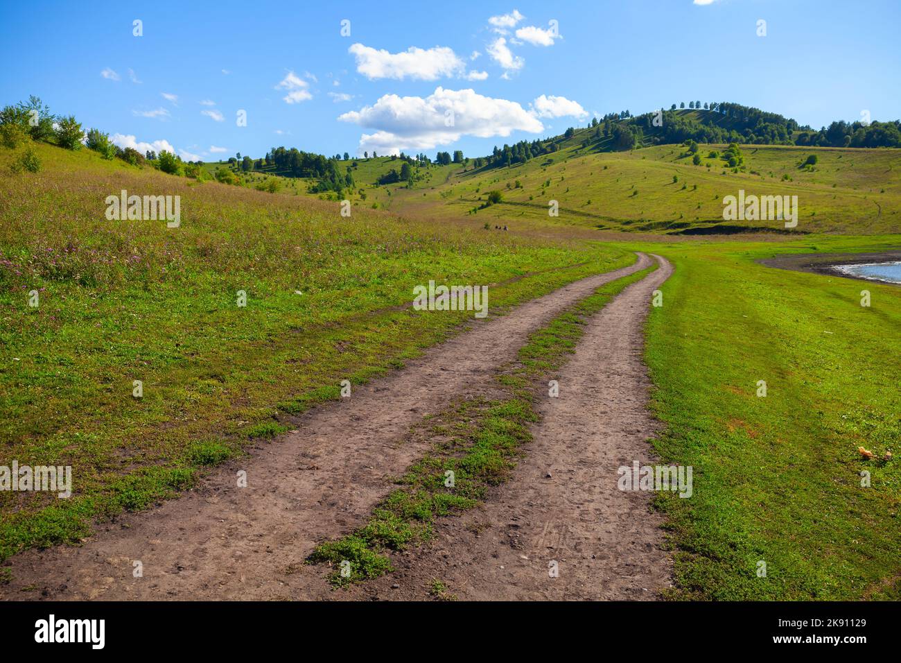Rural road goes up to the mountain, Altai Territory, Altai District ...