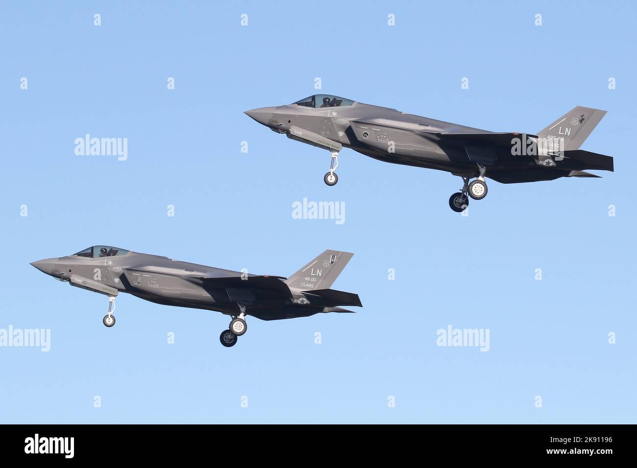 A pair of Lockheed Martin F-35A Lightning II strike fighters on the approach into RAF Lakenheath. Stock Photo