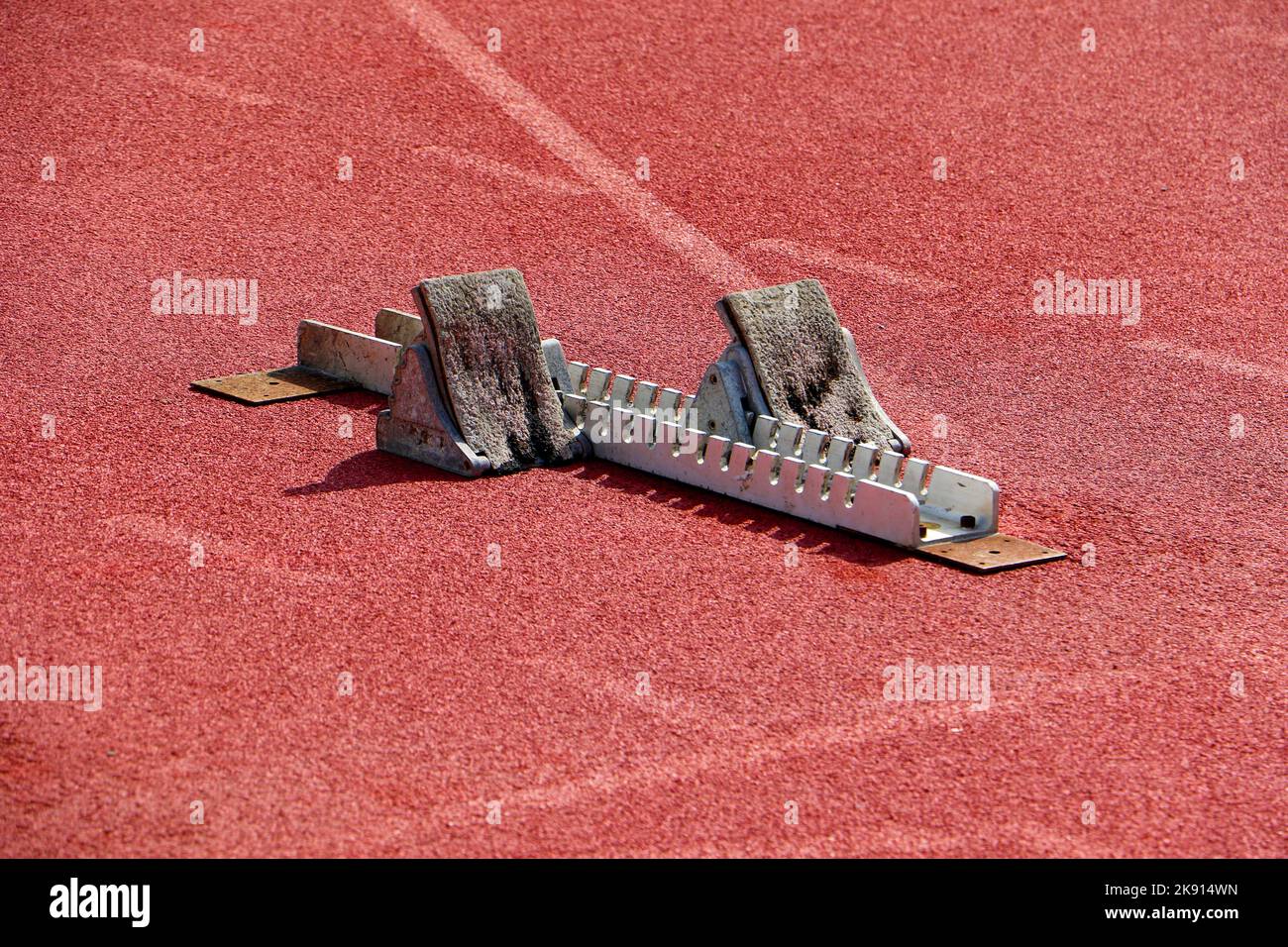 Sprinters starting blocks on athletics track Stock Photo