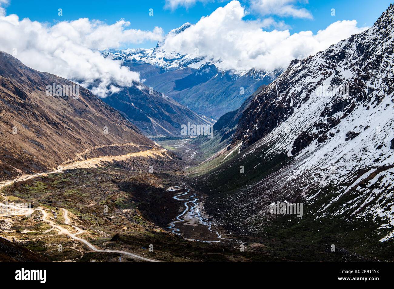 A high-angle of snowy ridged Kala Patthar, Sikkim, India, sunlit ...