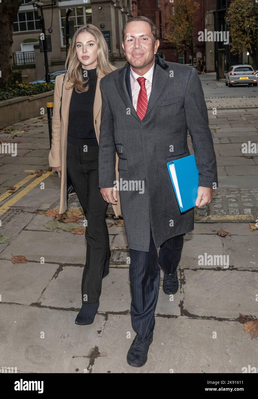 James Stunt, ex-husband of Formula One heiress Petra Ecclestone, leaves Cloth Hall Court in Leeds with Helena Robinson, where he is trial for money laundering charges with seven other defendants. They all deny the same money laundering charge involved depositing cash in the account of Bradford gold dealer Fowler Oldfield between January 2014 and September 2016. The sum involved is in excess of £250 million. Picture date: Tuesday October 25, 2022. Stock Photo
