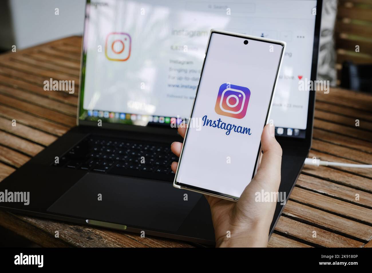 CHIANGMAI, THAILAND - July 09, 2021: A woman holding smartphone with Instagram application on the screen. Instagram is a photo sharing app for Stock Photo