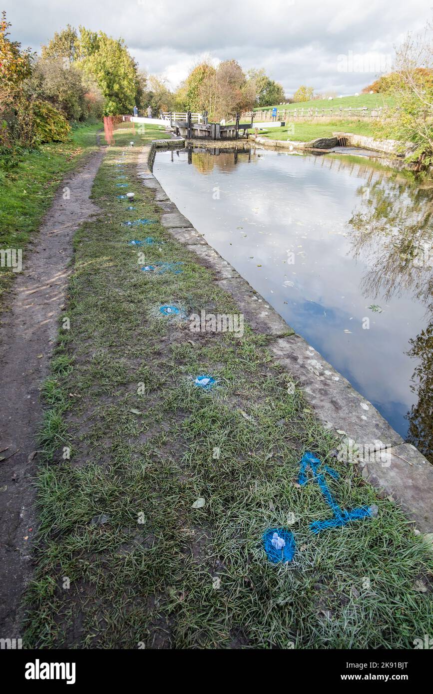 Holes prepared for polyurethane resin grouting on canal wall on Leeds
