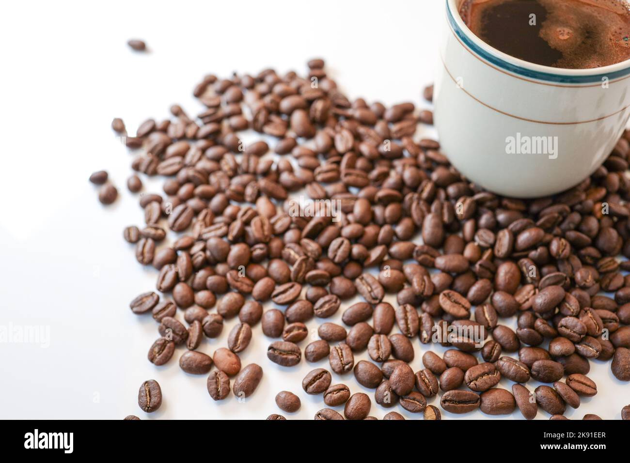 coffee beans on a white background with a cup of black coffee Stock ...