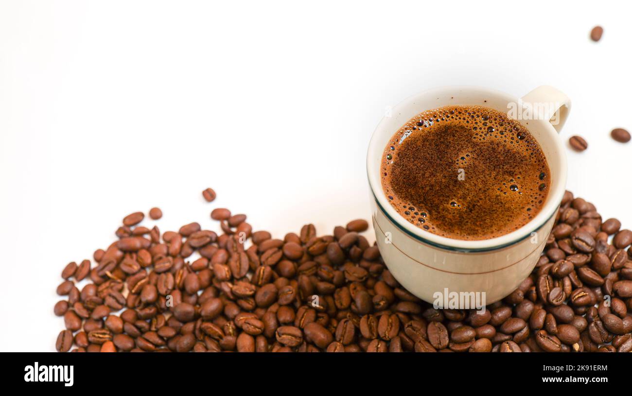 coffee beans on a white background with a cup of black coffee Stock ...