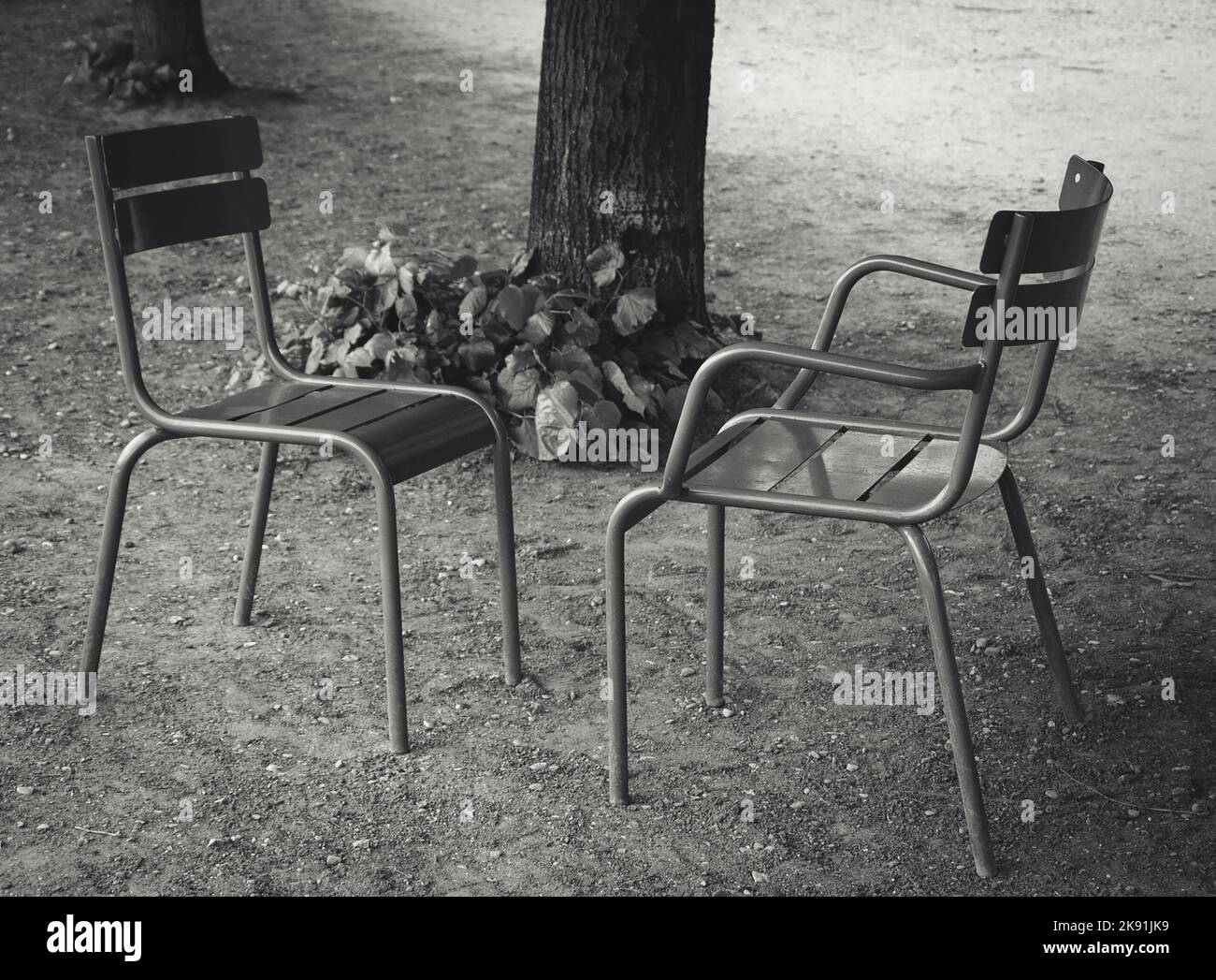 Dialogue. Two chairs facing each other in Tuileries garden. Paris