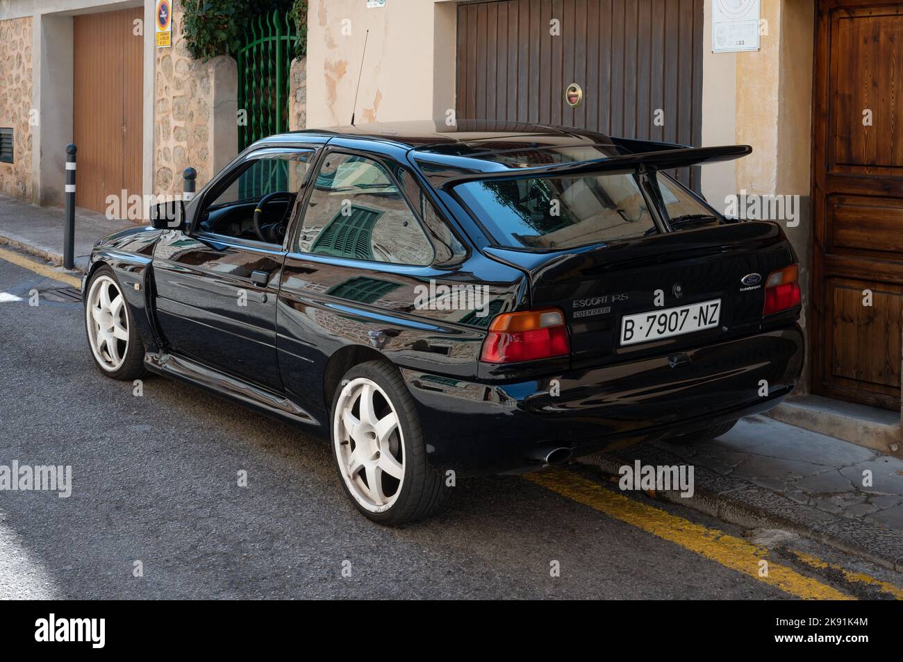 A vintage black Ford Escort RS Cosworth MK5 rally sports car parked on the street in Soller, Spain Stock Photo