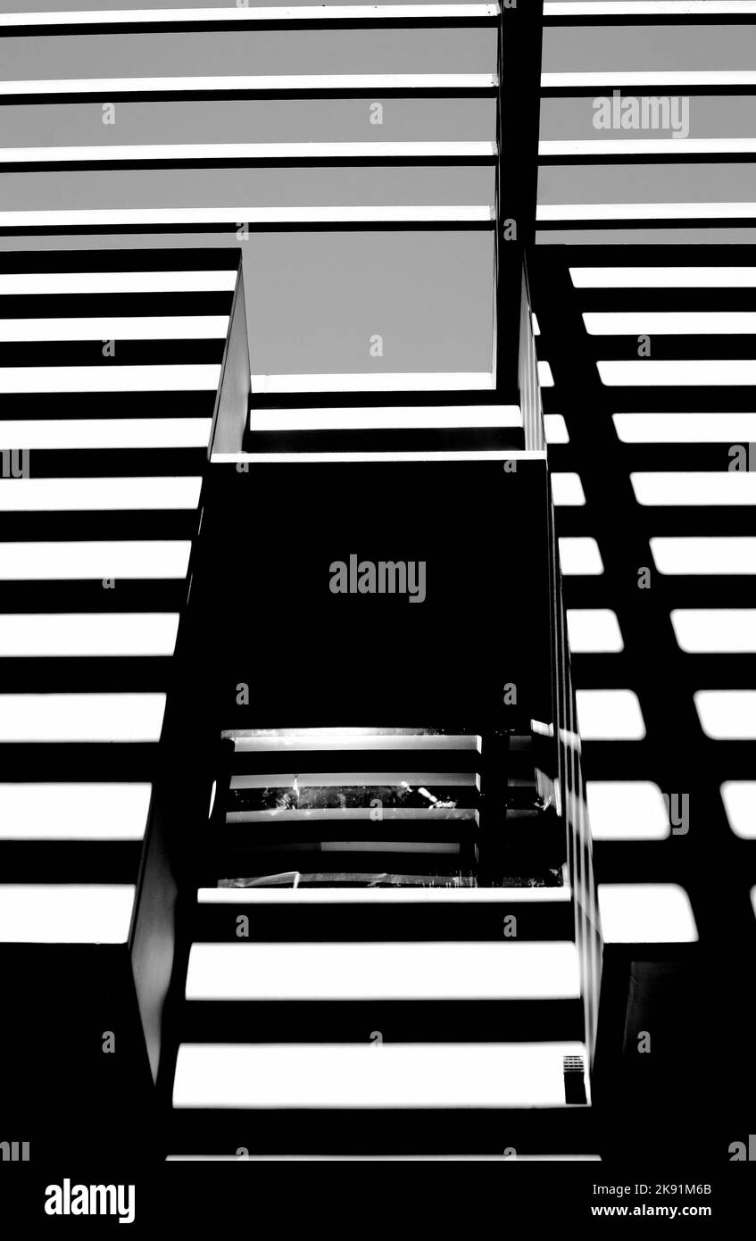 A vertical grayscale shot of the striped design of the Cal State LA library Stock Photo