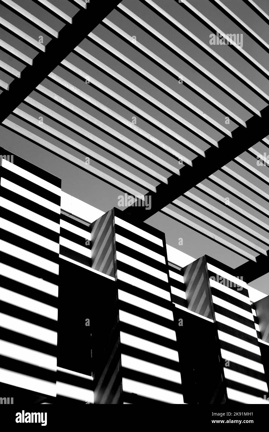 A vertical grayscale shot of the striped design of the Cal State LA library Stock Photo