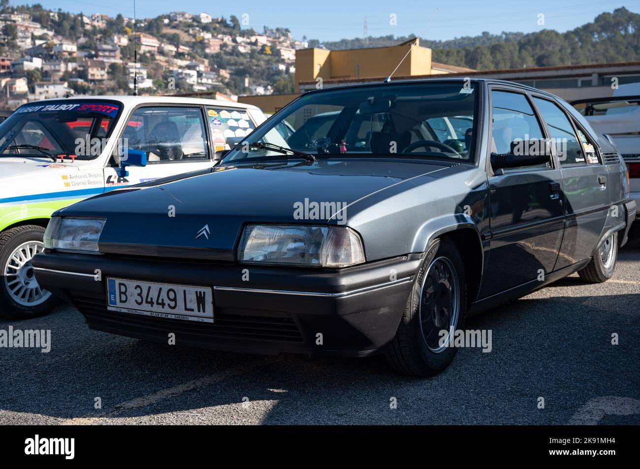 The detail of an old dark grey Citroen BX with hydropneumatic