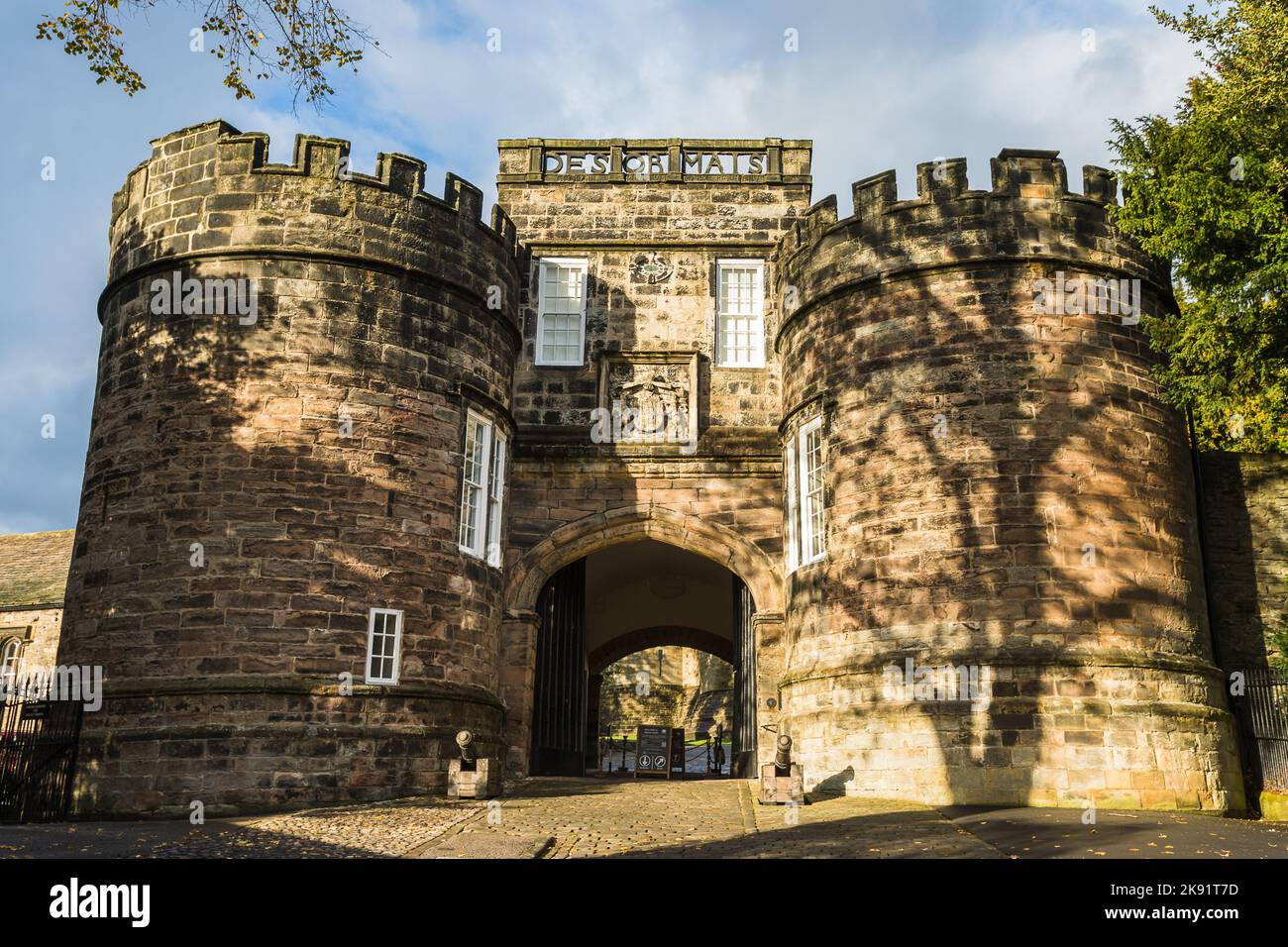 Cannons pictured in front of Skipton Castle in Yorkshire pictured in October 2022 under a blue sky. Stock Photo