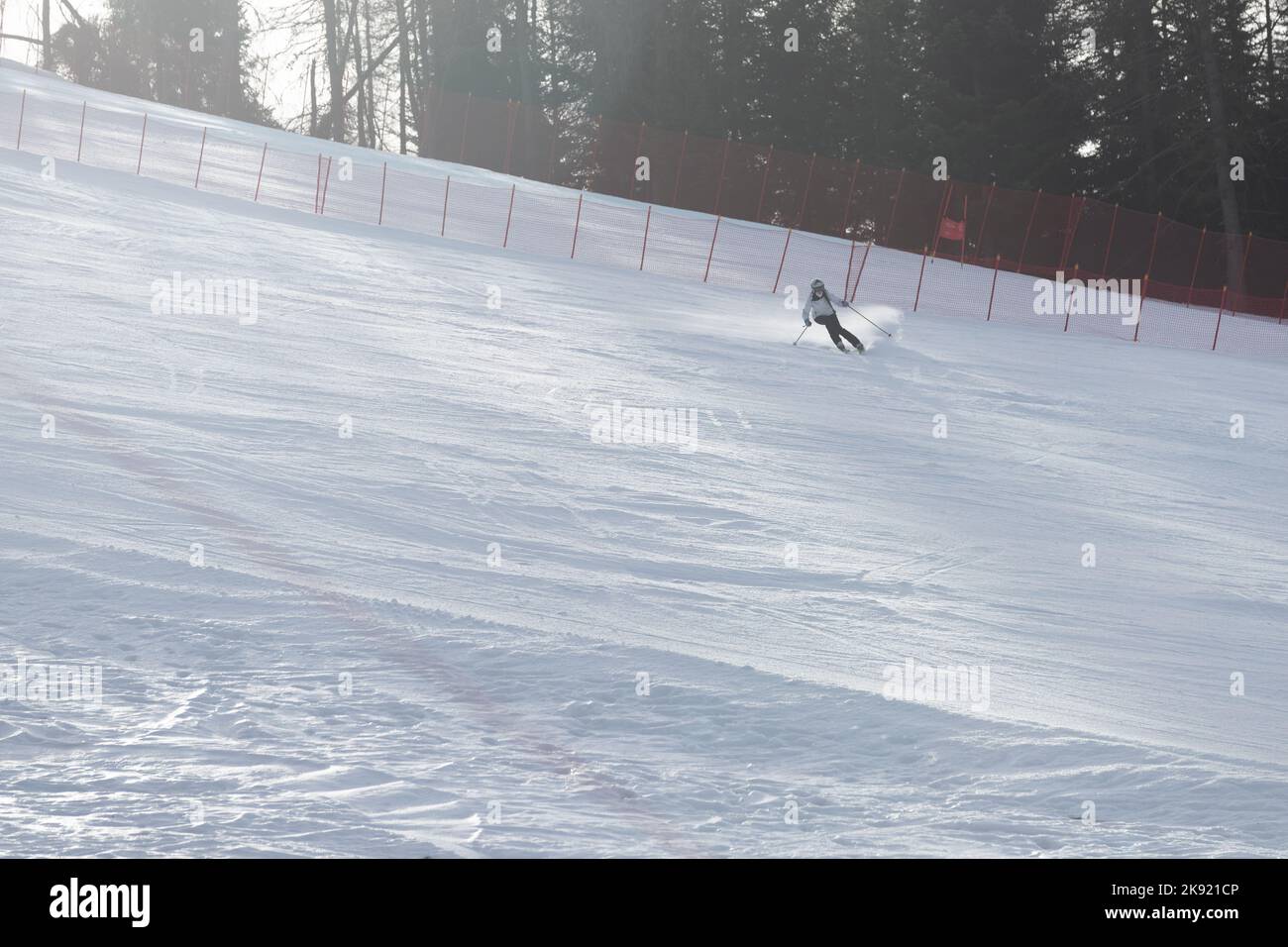 skier on a slope photography against light Stock Photo