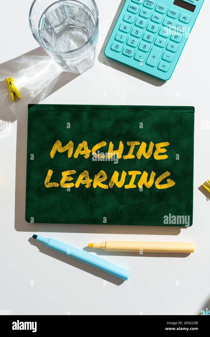 Handwriting text Machine Learning. Word Written on the concept that a computer can learn new data itself Stock Photo