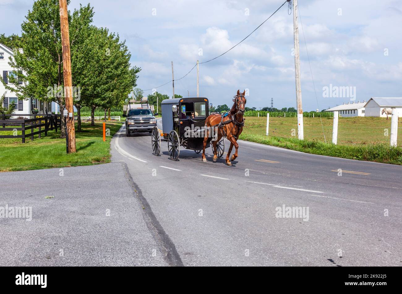 LANCASTER, USA JULY 13, 2010 amish people ride in their horse carts