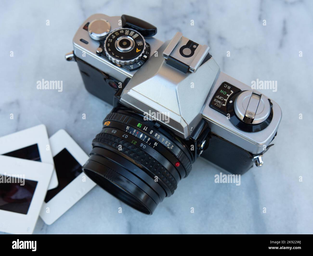 Retro film camera and slide film Stock Photo