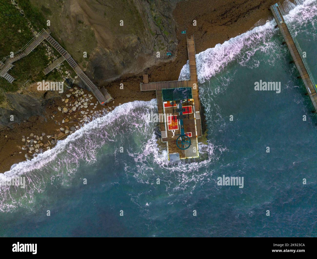 Aerial view of empty chairs on the cable chair lift to Alum Bay at the