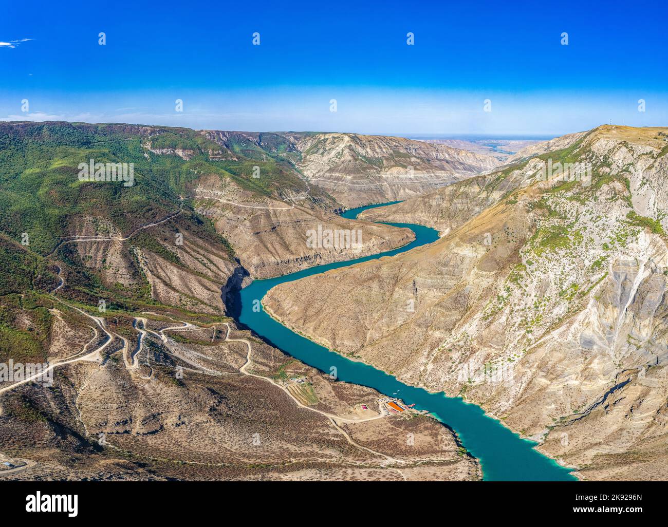 Aerial drone view to deep Sulak canyons. Stunning curving turquoise river among mountains. Picturesque panoramic landscape to valley. The deepest cany Stock Photo