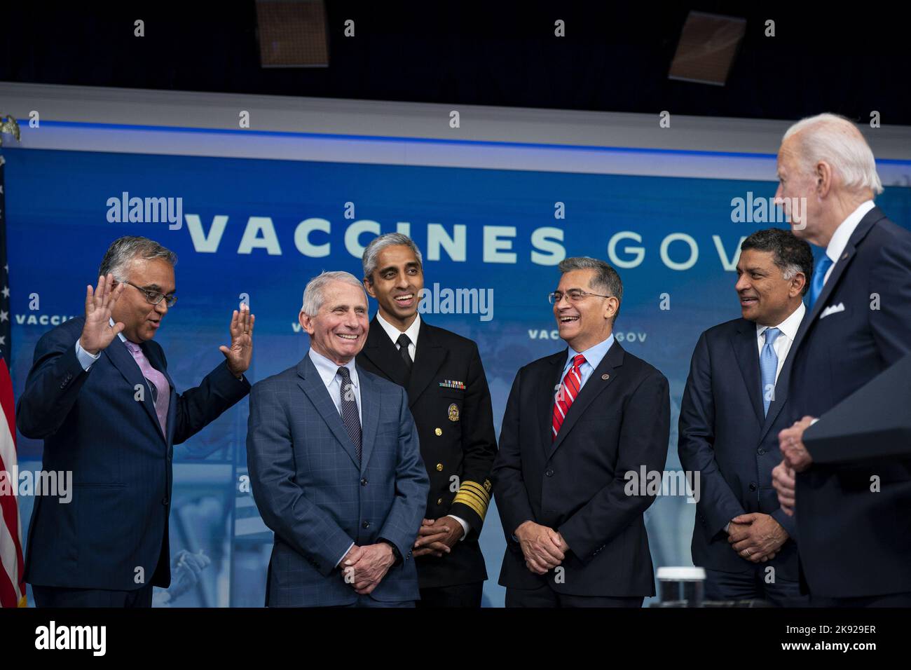 Ashish Jha, White House Covid-19 response coordinator, from left, Anthony Fauci, director of the National Institute of Allergy and Infectious Diseases, Vivek Murthy, US surgeon general, Xavier Becerra, secretary of Health and Human Services (HHS), and Vivek Sankaran, chief executive officer of Albertsons Companies, Inc., laugh following being asked by US President Joe Biden if they were getting their shot today, before Biden received a booster dose of the Covid-19 vaccine targeting the Omicron BA.4/BA.5 subvariants in the Eisenhower Executive Office Building in Washington, DC, on Tuesday, Octo Stock Photo