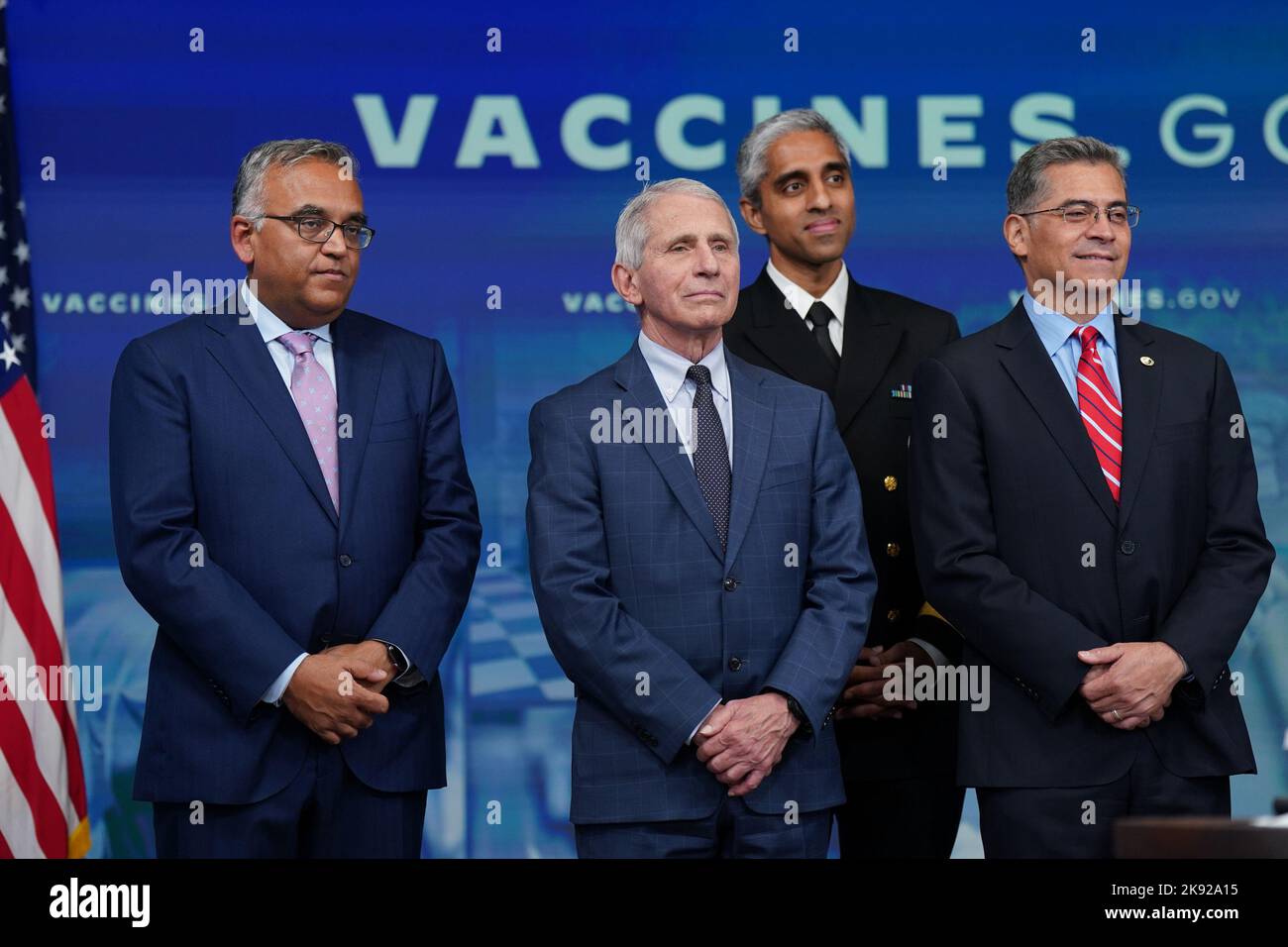 Ashish Jha, White House Covid-19 response coordinator, from left, Anthony Fauci, director of the National Institute of Allergy and Infectious Diseases, Vivek Murthy, US surgeon general, and Xavier Becerra, secretary of Health and Human Services (HHS), listen as US President Joe Biden, not pictured, speaks before receiving a booster dose of the Covid-19 vaccine targeting the Omicron BA.4/BA.5 subvariants in the Eisenhower Executive Office Building in Washington, DC, on Tuesday, October 25, 2022. The White House is asking businesses to help employees get updated coronavirus vaccines by hosting o Stock Photo