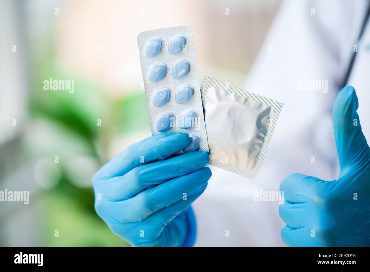 Man holding condom hires stock photography and images Alamy