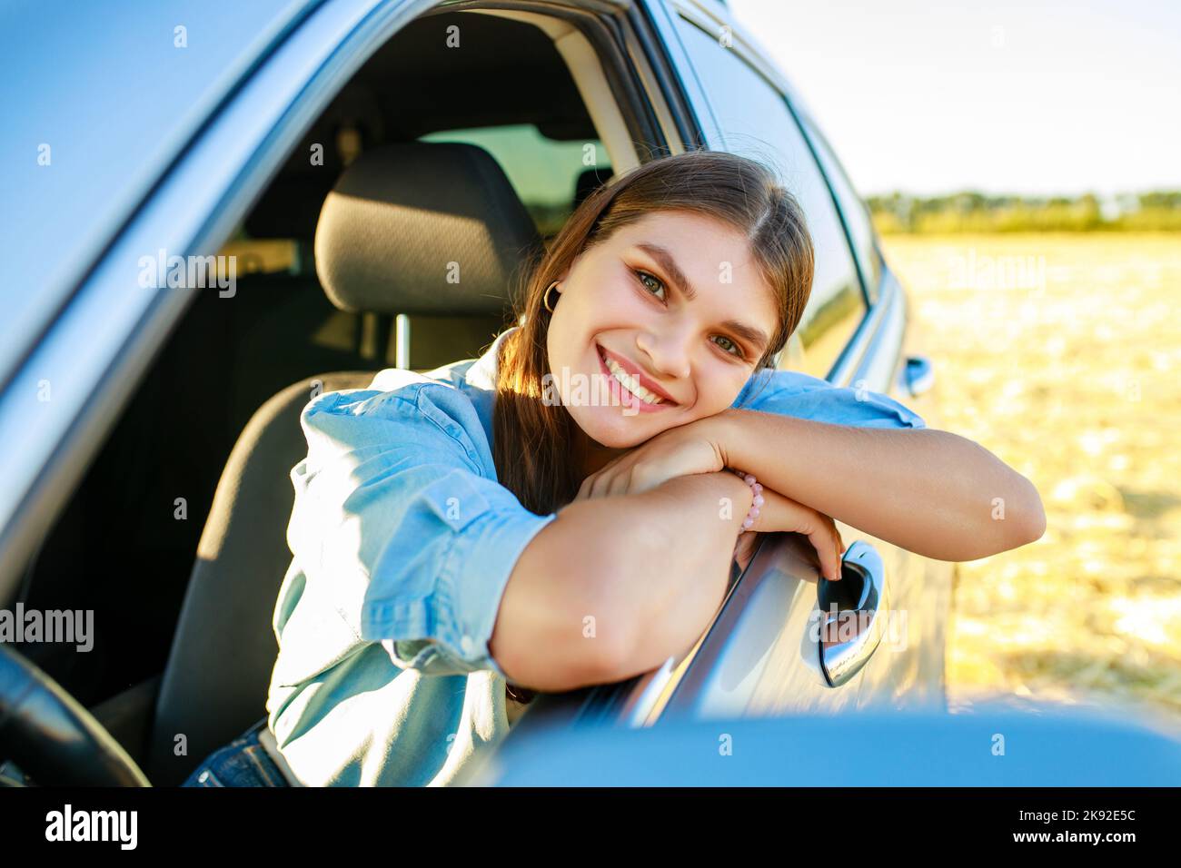 Young woman in blue shirt hi-res stock photography and images - Alamy