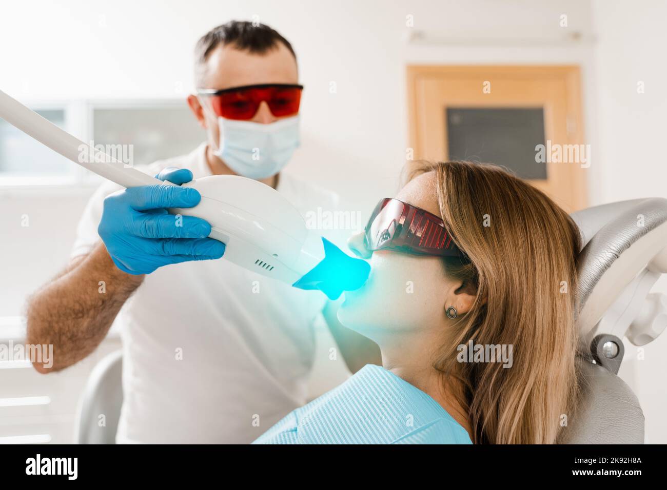 Artificial teeth whitening. Dental ultraviolet whitening treatment with