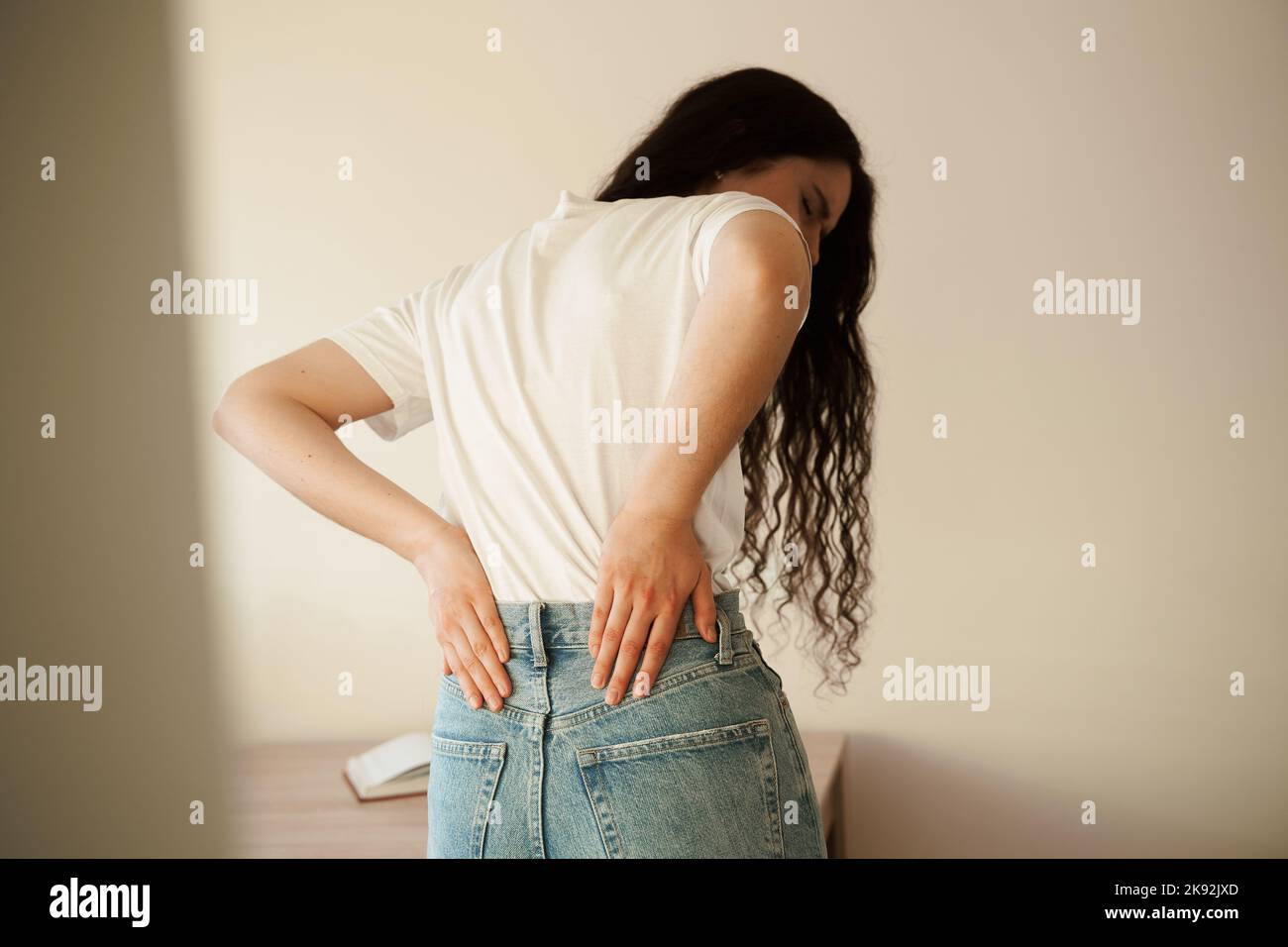 Attractive woman feel backache spine pain because of UTI pyelonephritis