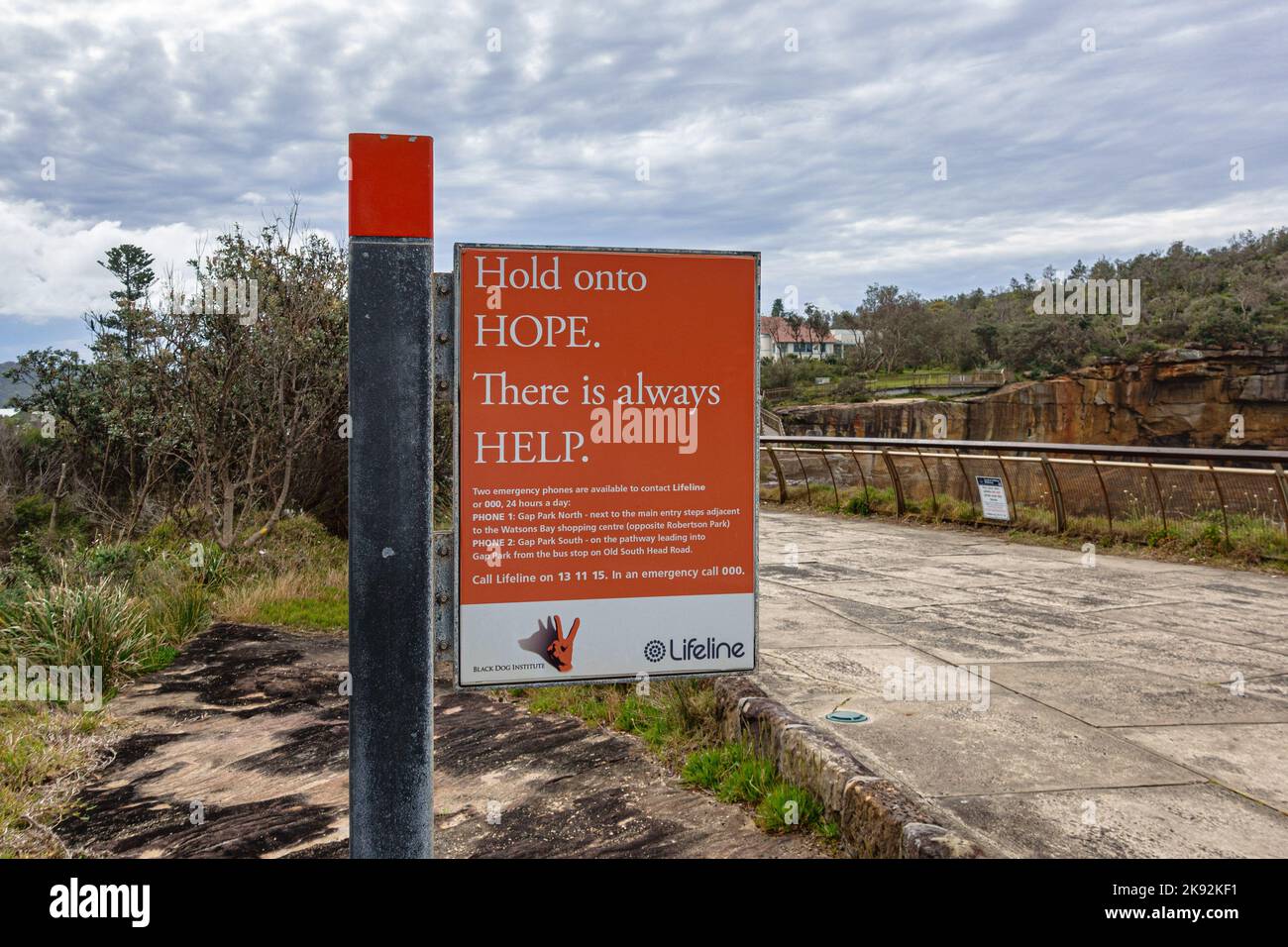 A sign for the Lifeline suicide prevention crisis hotline at The Gap in Watson's Bay, Sydney, Australia Stock Photo