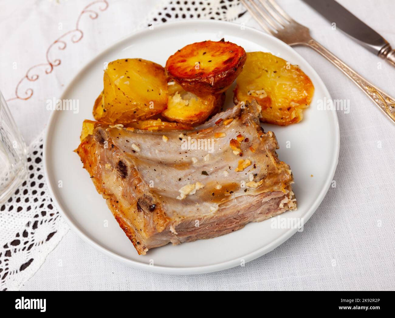 Ccostillas de cerdo - pork ribs with boiled potatoes Stock Photo