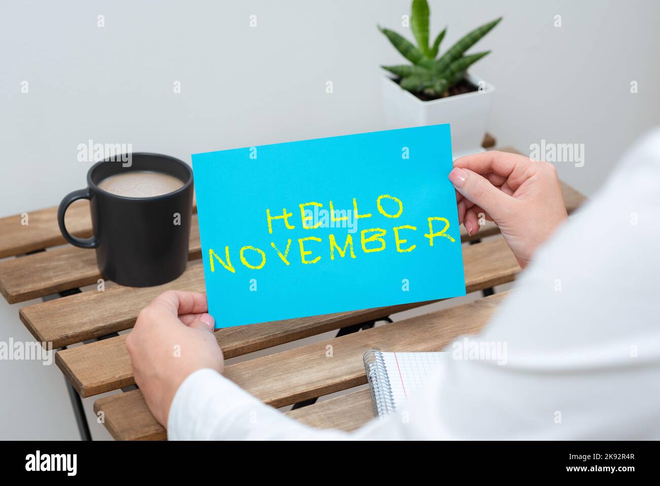 Hand writing sign hello november word written on greeting used when