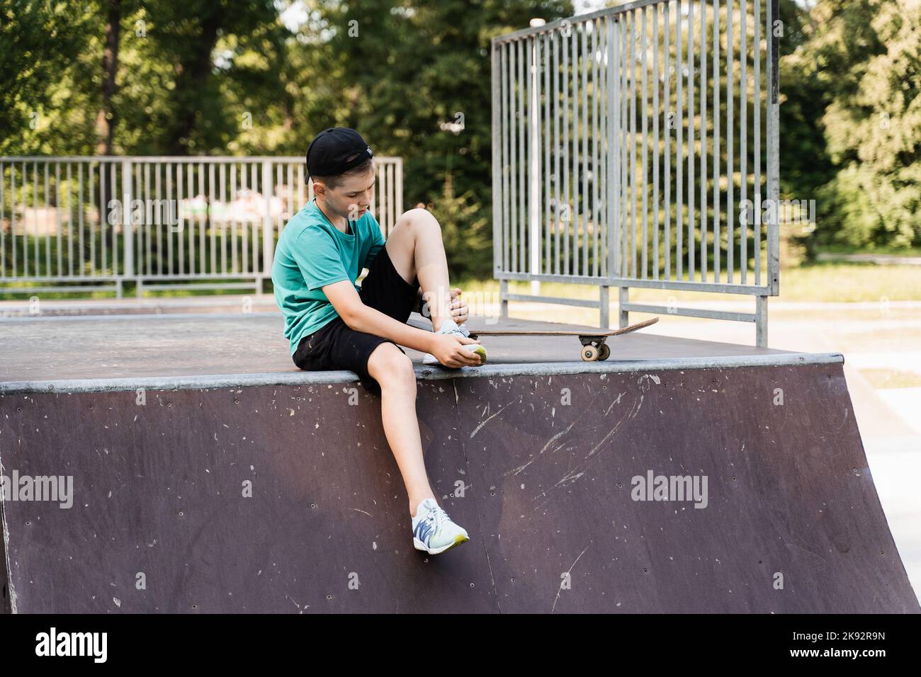 Leg and knee injury on skate board. Child traumatology. Child boy