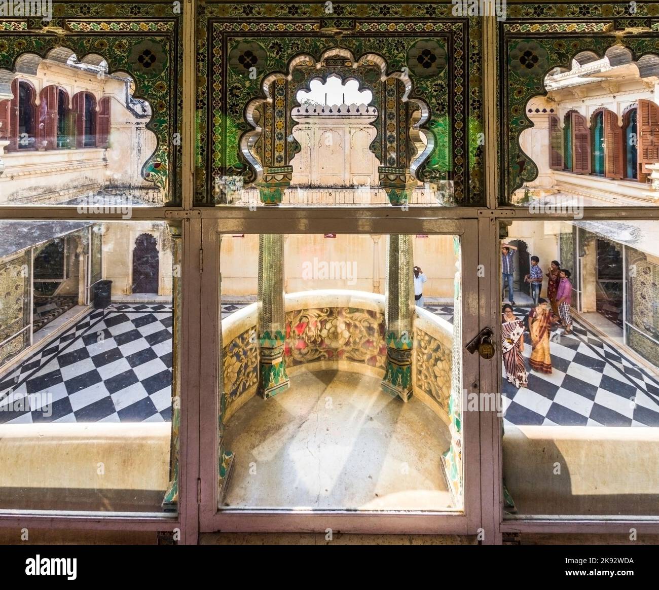UDAIPUR, INDIA - OCT 21, 2012: local people visit the City Palace in Udaipur, India. The foundation of the fort was laid in 1559  by Udai Singh. Stock Photo