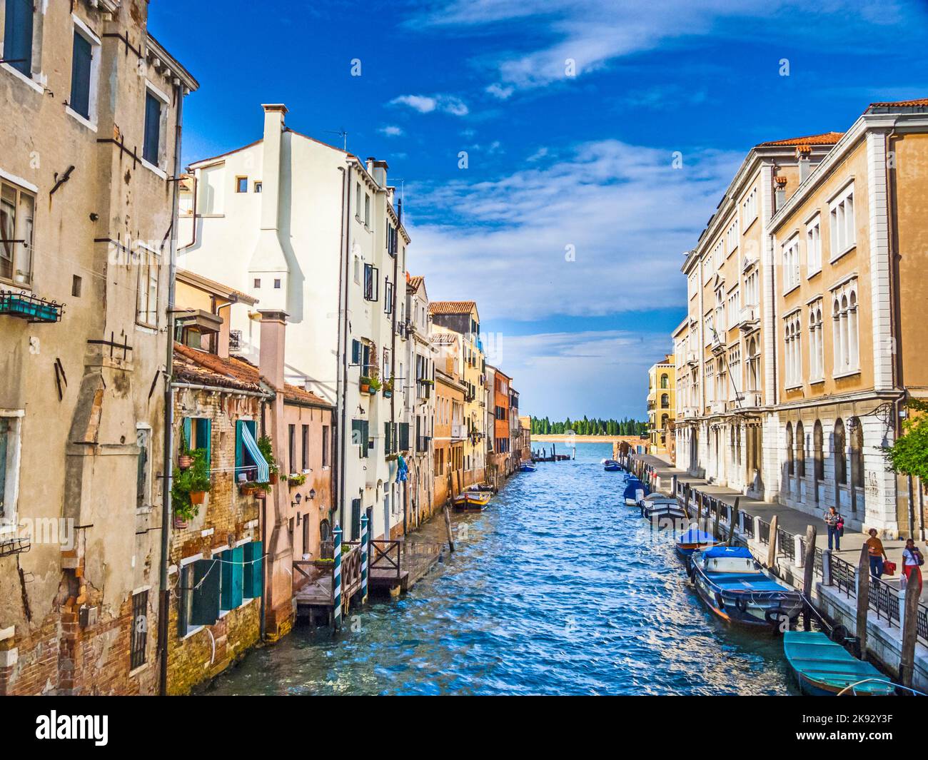 VENICE, ITALY - SEP 13, 2014: Narrow Canal Lined with Low Rise Buildings, Iconic Canal Scene in Venice, Italy Stock Photo