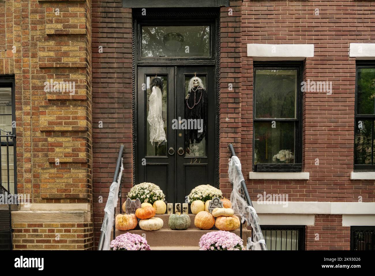 Front of apartment building decorated with spider web for Halloween