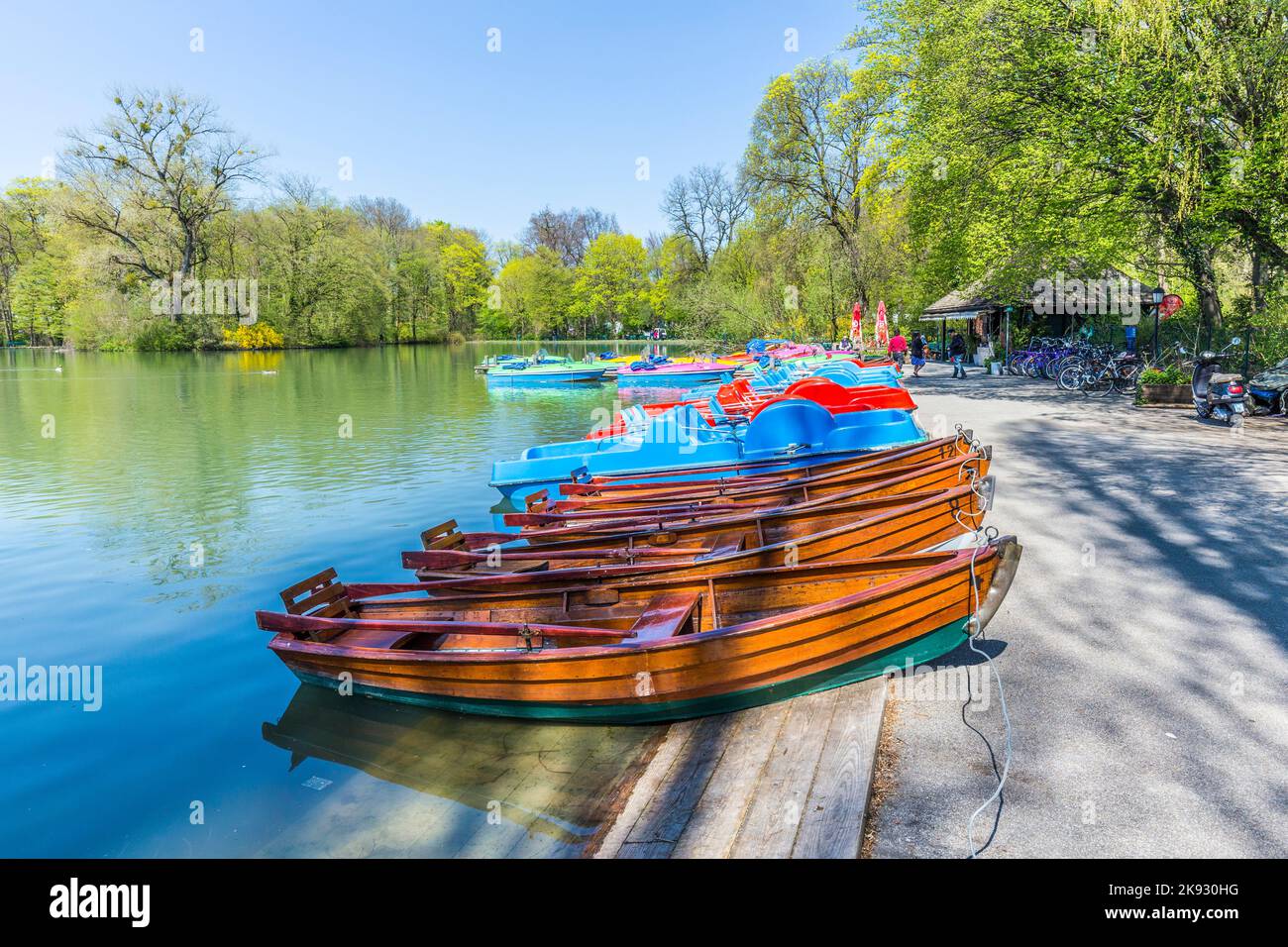 MUNICH, GERMANY - APR 20, 2015: boats for rent at the  Seehaus in Munich, Germany. This pier is placed at the Kleinhesseloher lake in the English Gard Stock Photo
