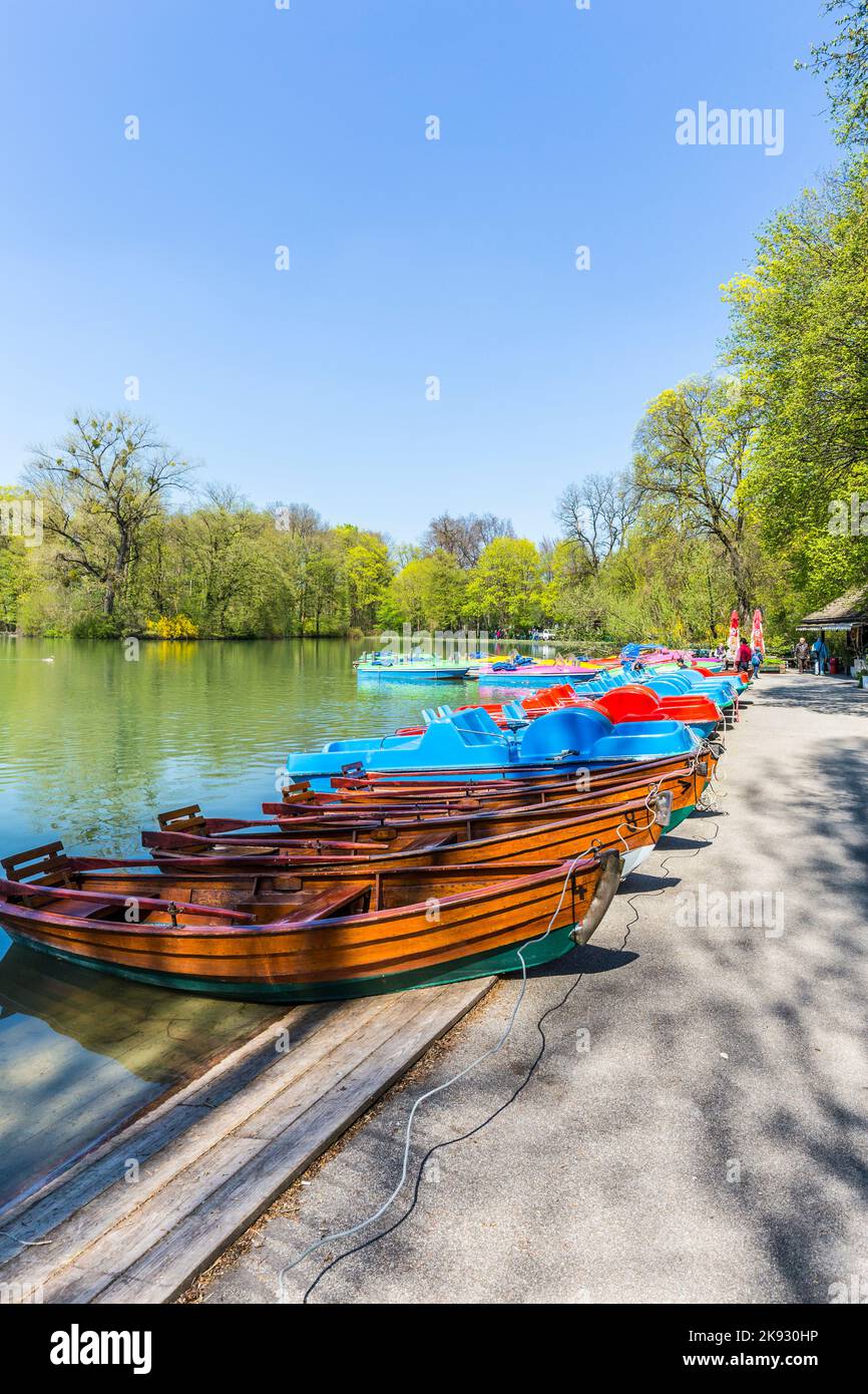 MUNICH, GERMANY - APR 20, 2015: boats for rent at the  Seehaus in Munich, Germany. This pier is placed at the Kleinhesseloher lake in the English Gard Stock Photo
