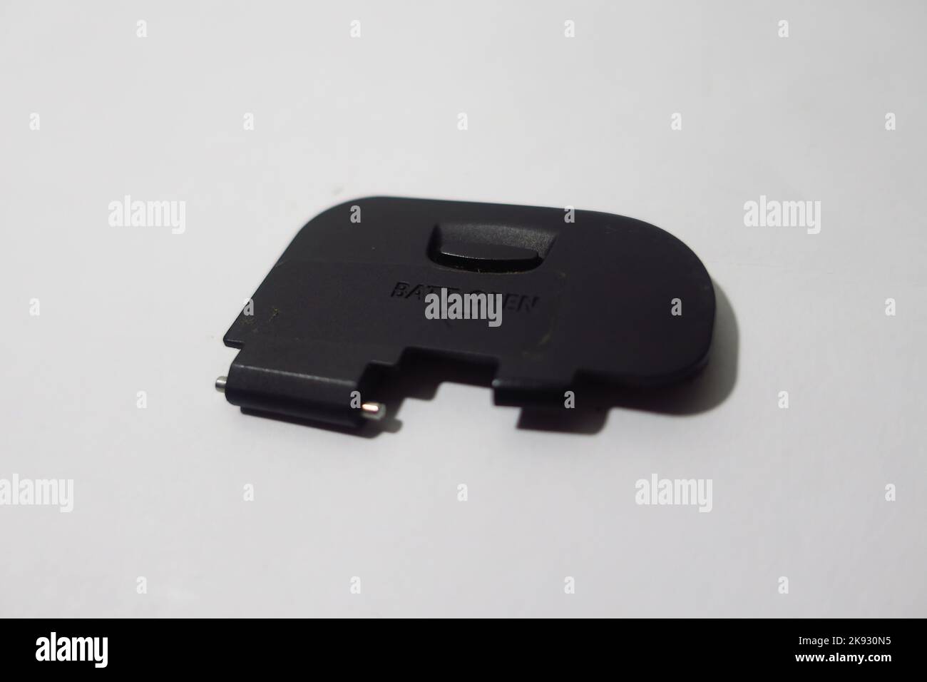 camera battery cover on white background Stock Photo Alamy