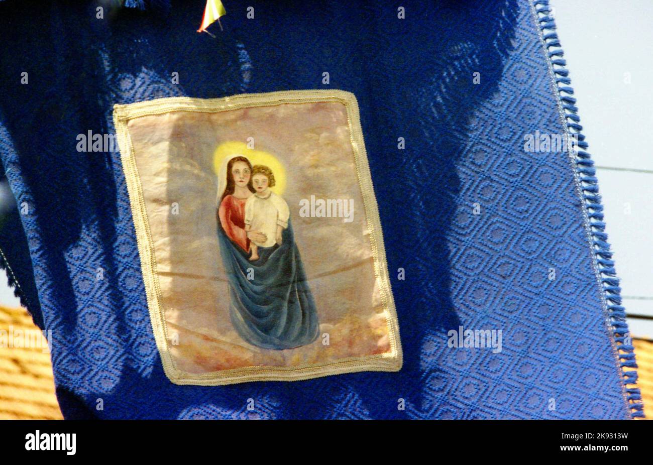 Harghita County, Romania, approx. 2002.  Christian Catholic pilgrimage to the Franciscan monastery in Șumuleu Ciuc, a famous annual event during the Pentecost. Close-up on the design of a religious flag. Stock Photo