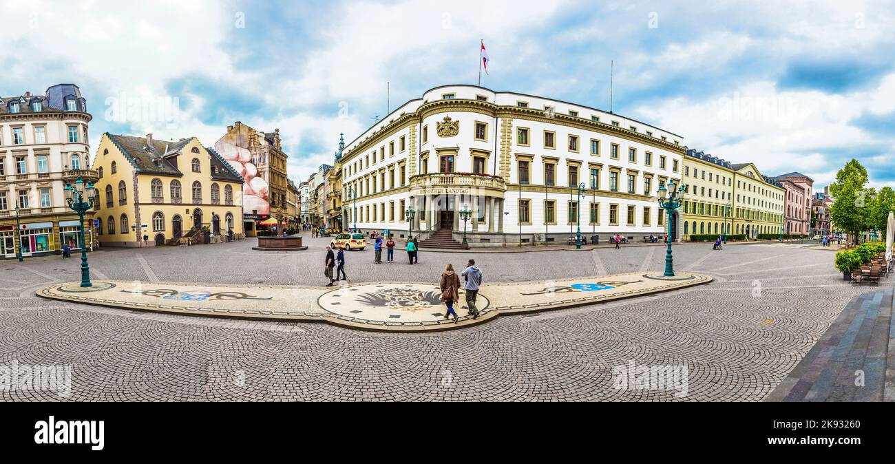 WIESBADEN, GERMANY - JUNE 21, 2015: people at the place in front of house of politics, the Hessischer Landtag in Wiesbaden, Germany. The building hous Stock Photo