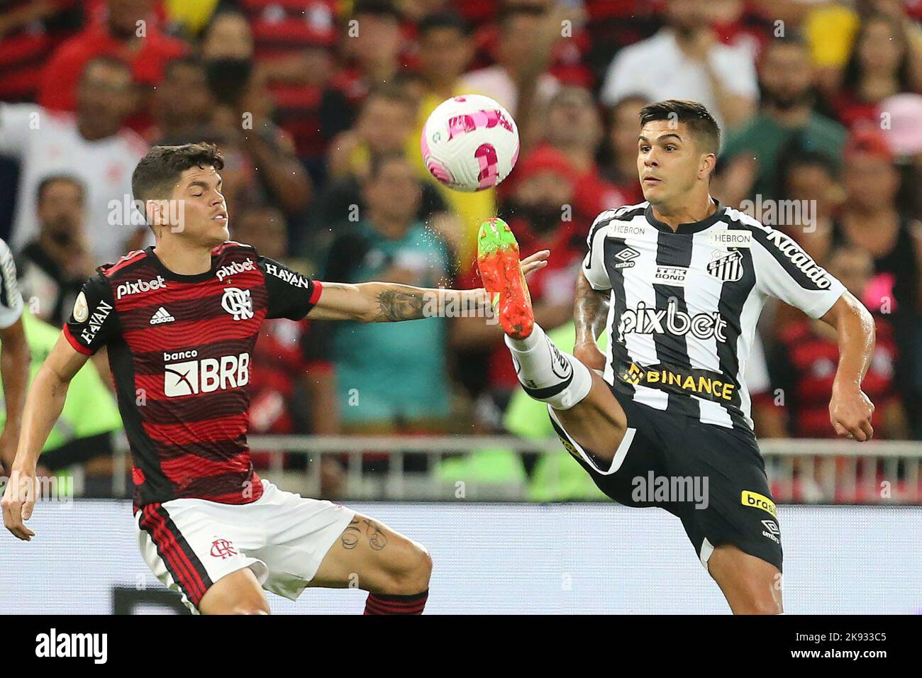 Ayrton Lucas of Flamengo heads the ball against Matias Rojas of