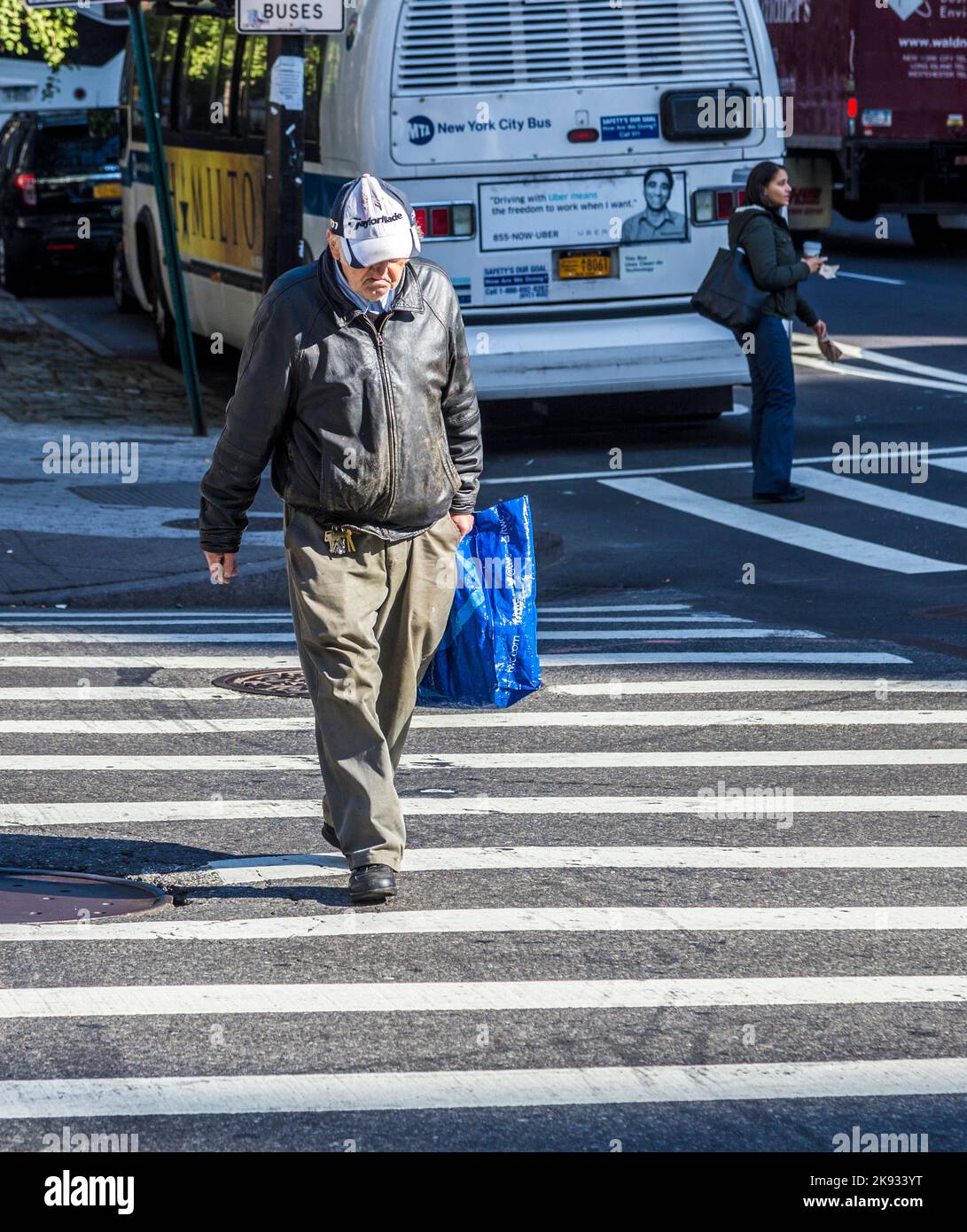 NEW YORK, USA - OCT 21 2015: people crossing a street at a pedestrian ...
