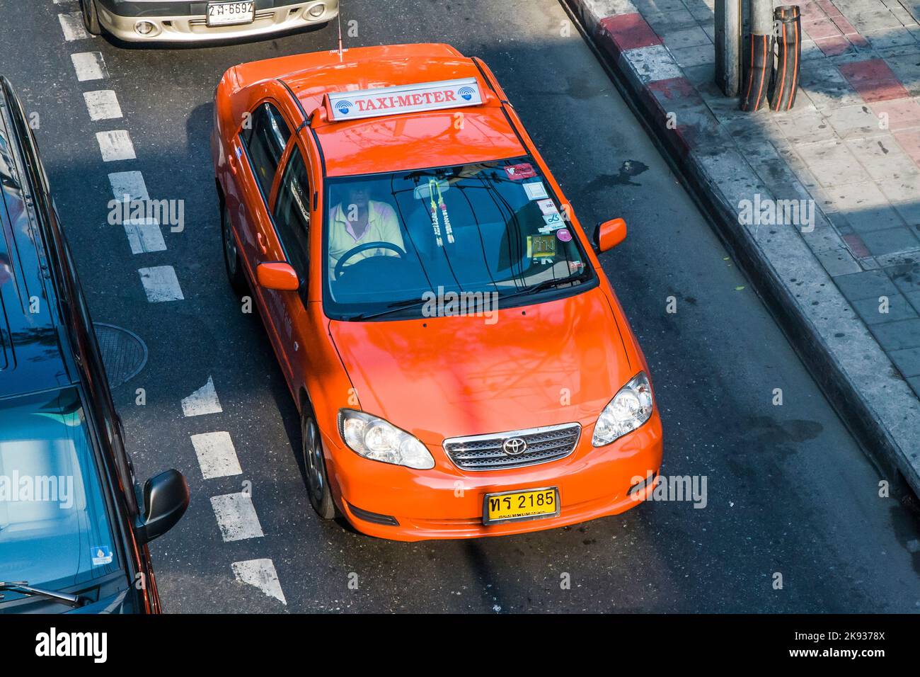 BANGKOK, THAILAND - JAN 9, 2008: taxi driver without passenger in Bangkok, Thailand. There are 150,000 taxis in Bangkok. All taxis are metered with th Stock Photo