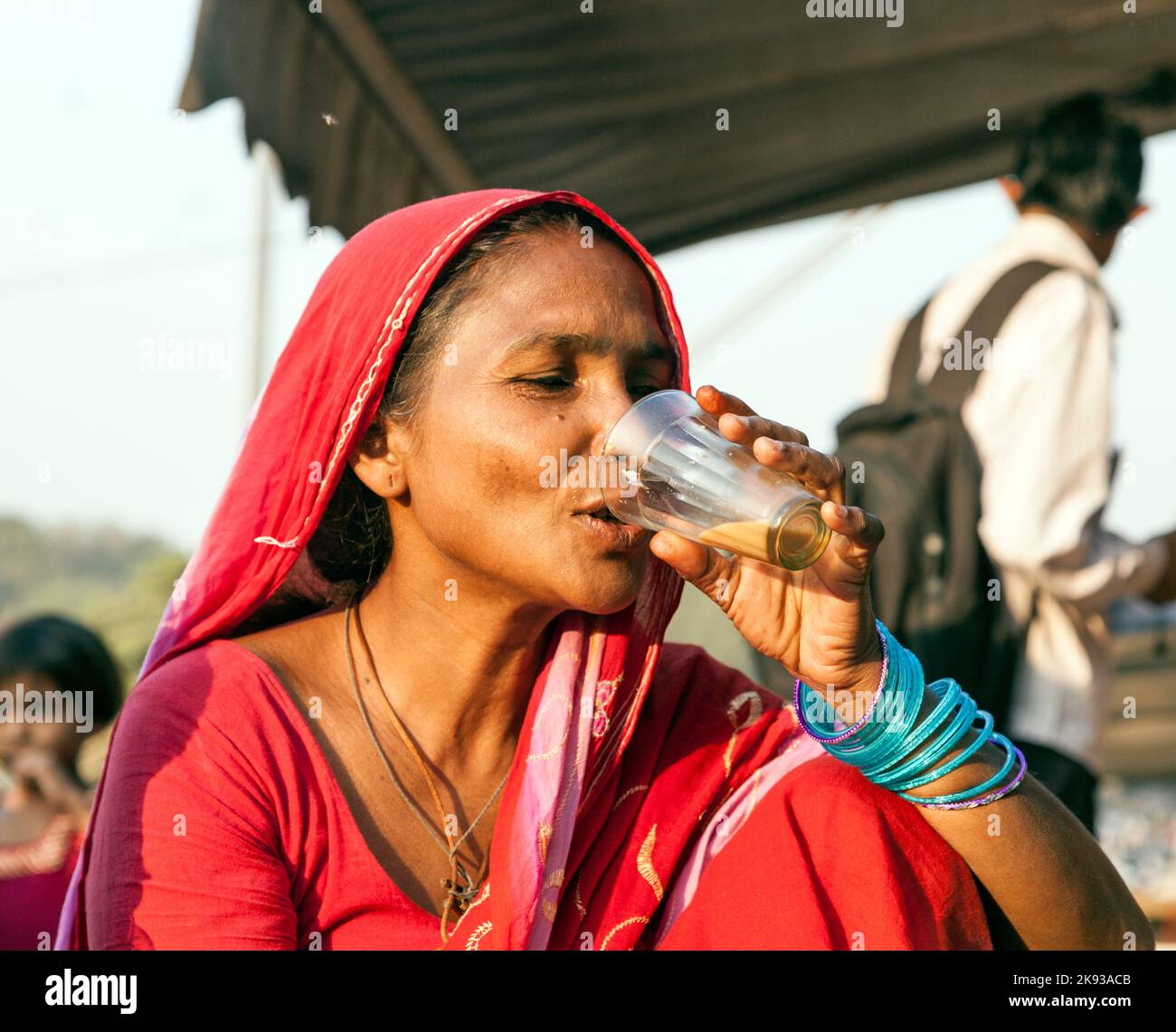 DELHI NOVEMBER 8, 2011 woman drinking tea at the Meena Bazaar Market