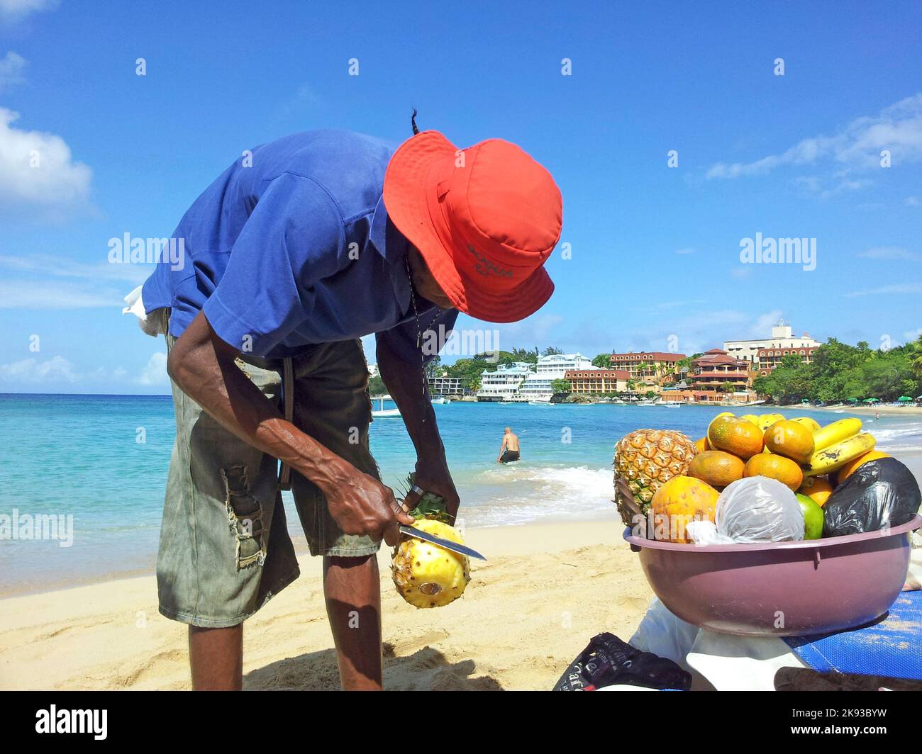 NAGUA, DOMINICAN REPUBLIC APRIL 2, 2014 man sells ananas at the