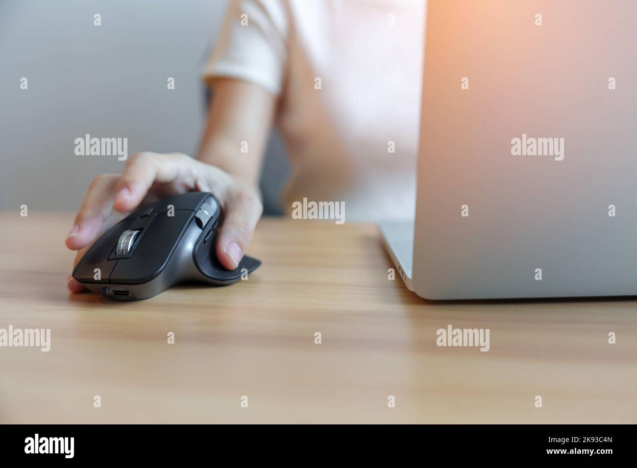 woman hand using ergonomic vertical mouse during working on Adjustable