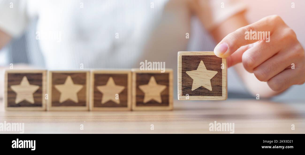 hand holding Star block. Customer choose rating for user reviews ...