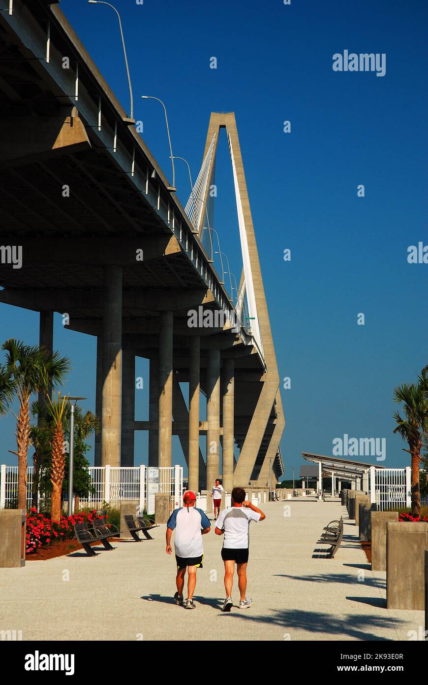 People partake in a healthy lifestyle by walking along the path and