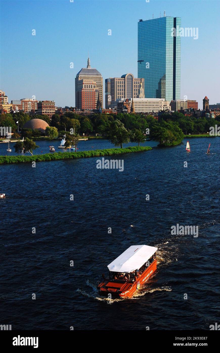 A Ride the Ducks duckmobile, a popular tourist attraction and tour, plies the Charles River in sight of the Boston skyline Stock Photo